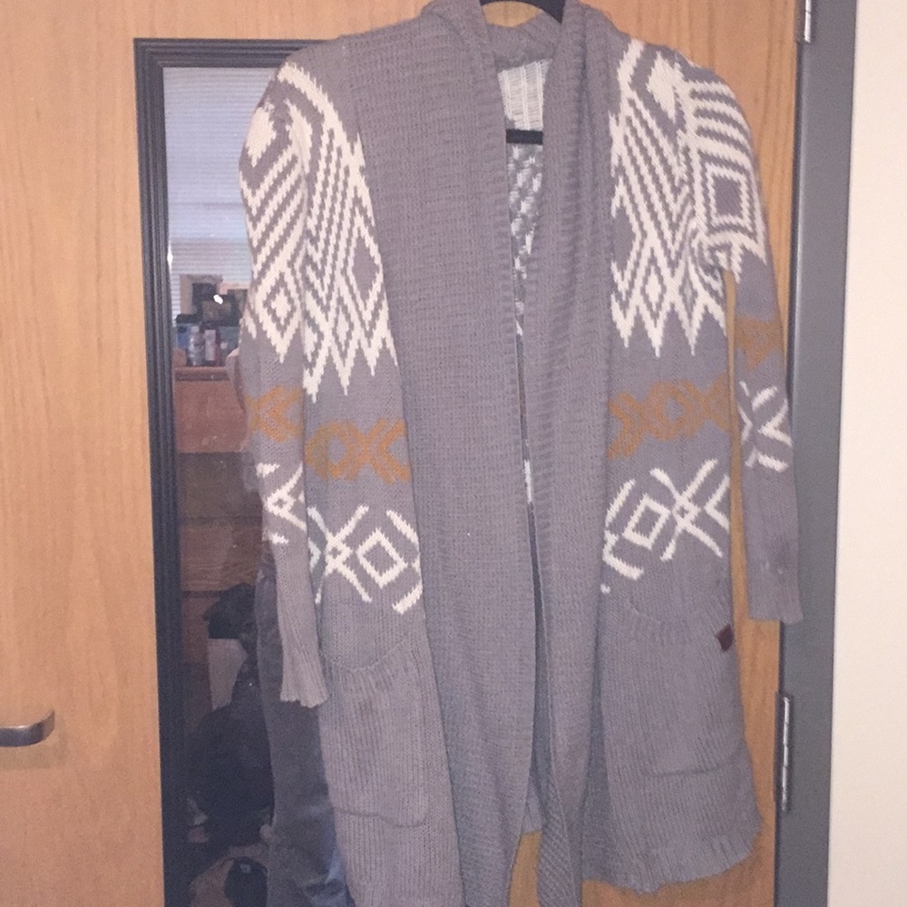 Long grey, orange and white patterned sweater